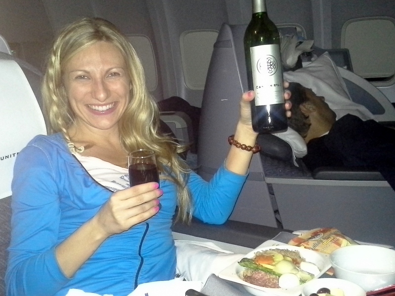 Svetlana flying LAX-JFK in a flat-bed. Lufthansa Miles & More charges only 17,000 miles each way for this flight.